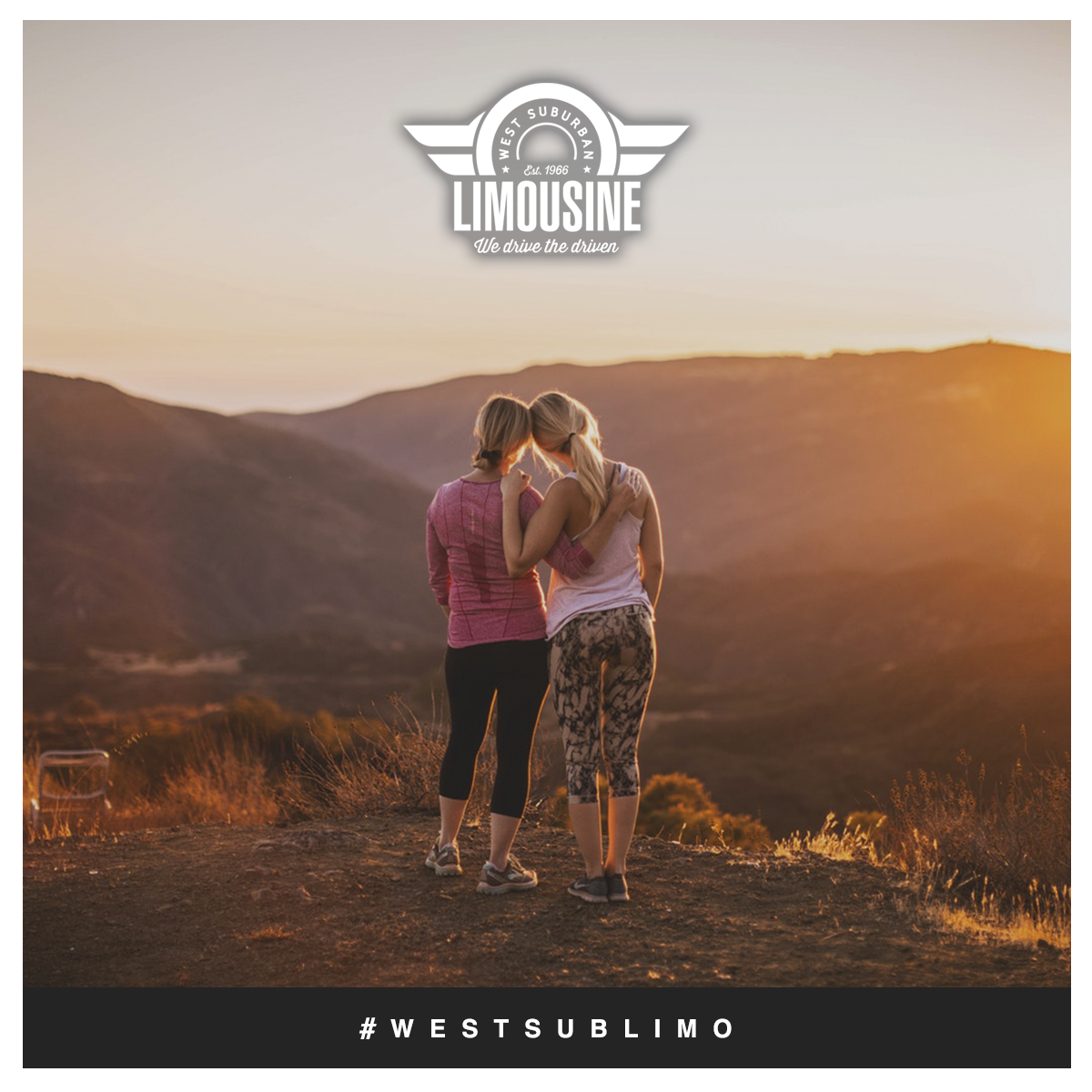 Mother and Daughter Watching the Sunset at the Top of a Mountain